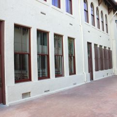 Maroon colored framed windows and doors.