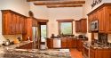 Cherry wood colored cabinets in a kitchen